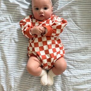 Checkerboard Orange and Cream Baby One-Piece